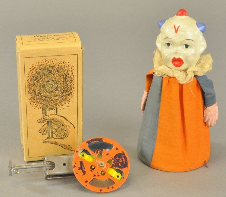 CHEIN HALLOWEEN SPARKLER AND SQUEEZE TOY: Composition head, "Made in Japan," squeeze toy and Chein & Co. sparkler with original box. 5" - 6' l.