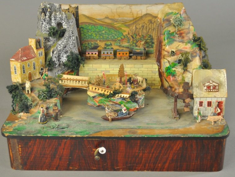 ERZGEBIRGE MUSICAL VILLAGE AUTOMATON: Germany, hand cranking automaton is finely detailed overall, features music while train crosses stone bridge, two lady's in boat move around the center island, mill sits on one side, church on hill ov