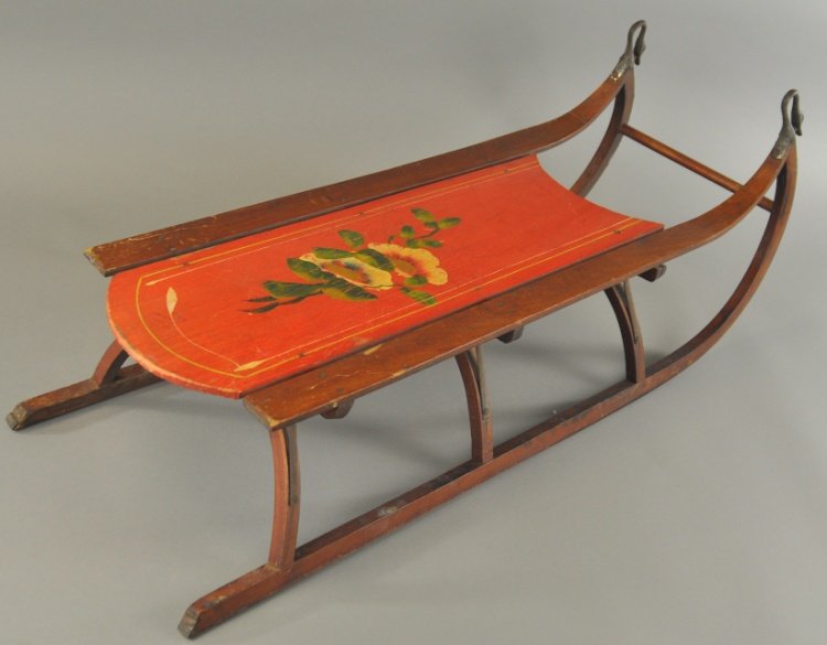 A FLOWER DECORATED CHILD'S SLED: A Paris Co., Maine type sled with swan head runners, nice red platform with flower decorations, shows very little use or wear. 35" l.