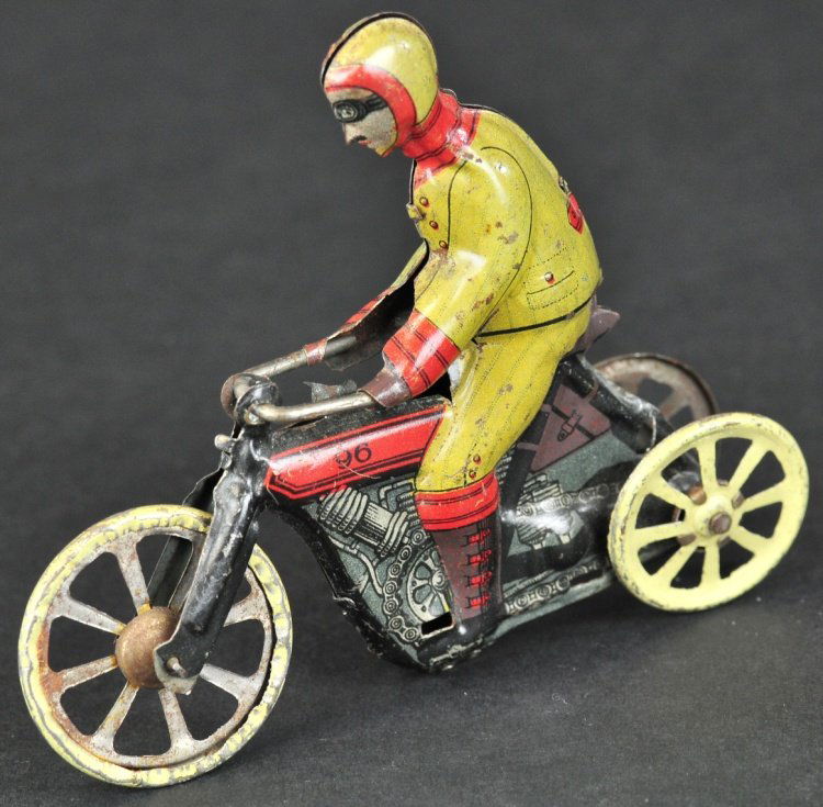 EARLY MOTORCYCLE PENNY TOY: Kellermann, Germany, rare lithographed tin example portrays motorcycle with rider in full racing attire, reads "96" on gas tank. 3 3/4" l.