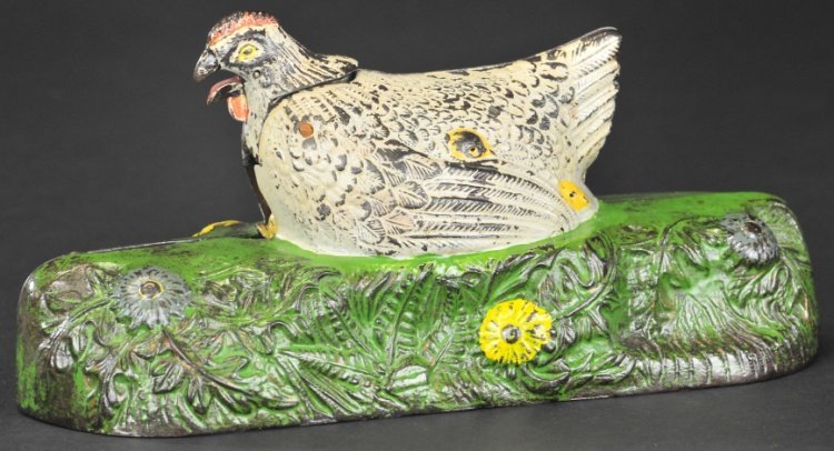 HEN ON NEST MECHANICAL BANK: J. & E. Stevens Co., designed by Charles A. Bailey, Patented 1901, white hen version, cast iron and heavily molded, placing coin in slot in front of hen and pressing lever causes hen to move head and 