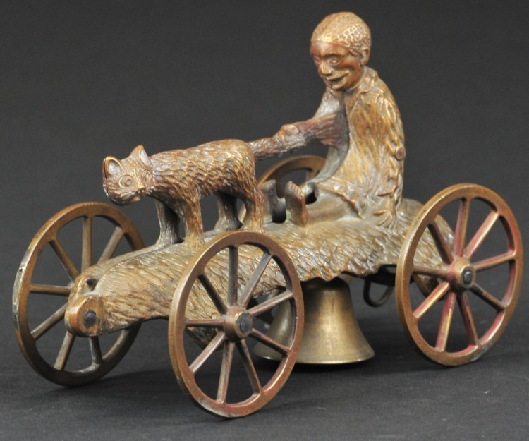 N. N. HILL BRASS CO. BOY AND CAT BELL TOY BRASS PA: Original all brass pattern for very whimsical bell toy with bell under center base, exceedingly rare example, boy faces straight ahead. 5 3/4" l.