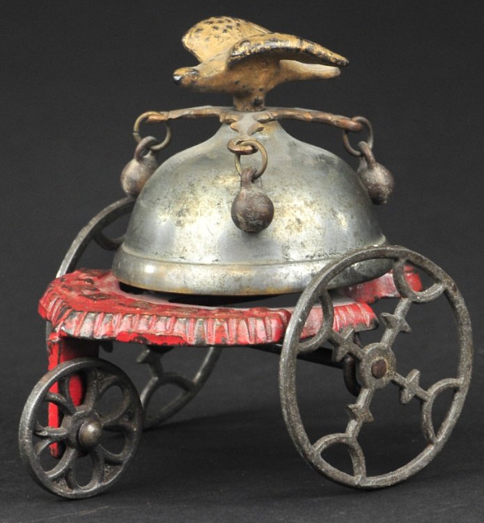 GONG BELL FIRE BELL TOY: circa 1876, cast iron, depicts eagle finial on dome with clappers on sides, embossed "Fire Bell" on red base. 8" l. </
