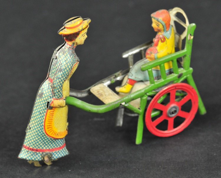 NANNY WITH CHILD PENNY TOY: Meier, Germany, interesting toy depicts nanny pushing child in wheeled high chair, die-cut feet on wheel underneath dress gives impression of walking motion. 3 1/4" l.