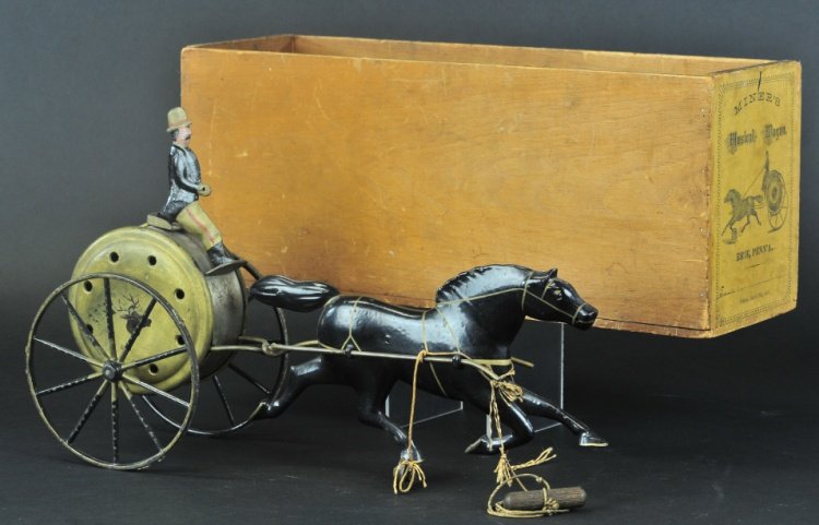 MINER'S MUSICAL WAGON WITH BOX: Patent 1884, exceedingly rare, Reportedly only known example purchased directly from the famed Louis Hertz collection, depicting seated gentlemen on large drum with spoke wheels and drawn by large cas