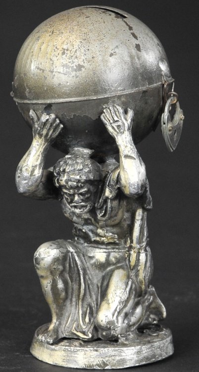 ATLAS HOLDING THE WORLD BANK: Germany, circa 1915, scarce still bank done in tin and lead, painted in silver overall, depicts the god Atlas holding world money box on his back, key lock clasp. 5" h.