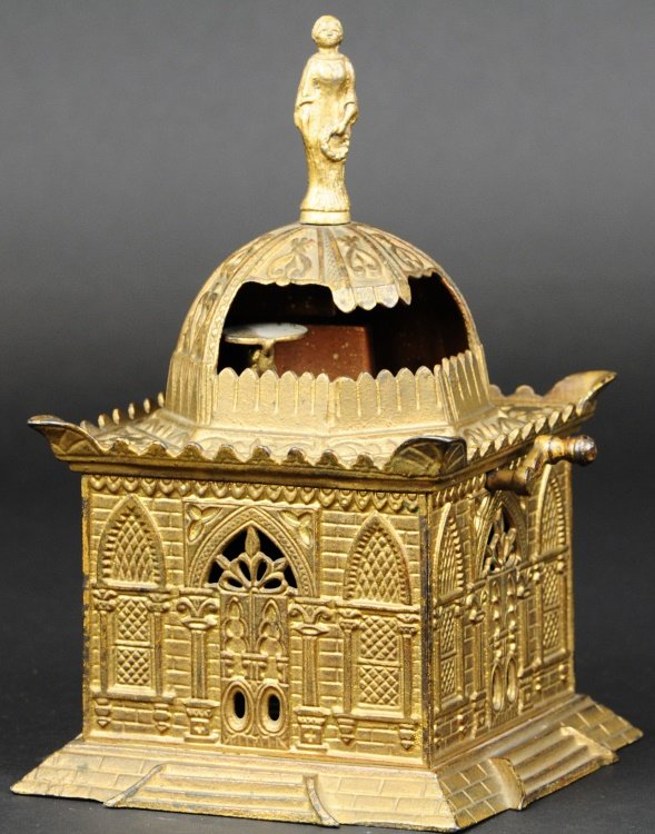 MOSQUE MECHANICAL BANK: Mfg. Judd Manufacturing Co., CT, circa 1880's, cast iron, painted in gold overall, place coin on gorilla's tray and turning crank allows him to move in back of cupola then return again.