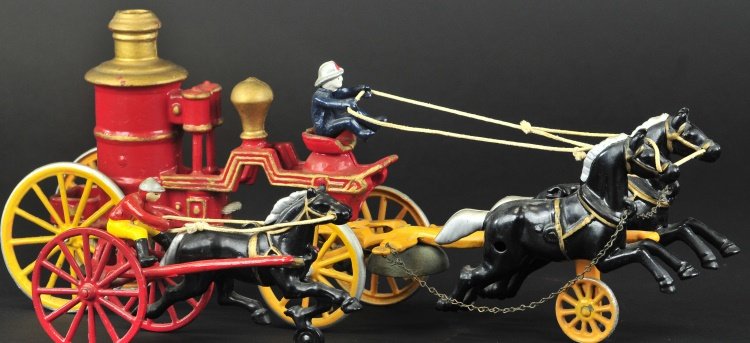 KENTON FIRE ENGINE AND SULKY SEARS TOYS: Both cast iron and made for the series, fire pumper is horse drawn and sulky features seated jockey. Provenance: Wally Tudor Collection. 8" & 17 1/2" l.