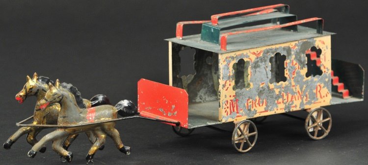 HORSE DRAWN OMNIBUS: Hand painted Early American tin example, reads, "Metropolitan R. P." on sides, open bench roof seating, drawn by two gold horses with red saddles, bus has rear steps on platform. 13" l.