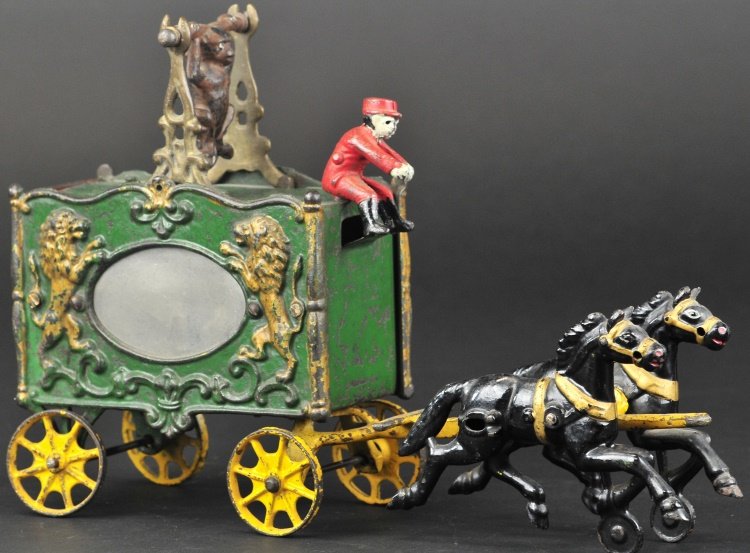 ROYAL CIRCUS TRAPEZE VAN: Hubley Mfg. Co., cast iron green wagon with mirrors on both sides, features cast monkey at rooftop, non-mechanical version, drawn by two horses. 12" l.