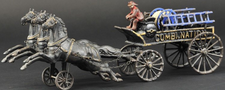 DENT COMBINATION WAGON: Cast iron, painted in black overall, gold trimmed embossed lettering, open bed has ladder supports and rear step, seated driver and drawn by three horses in flight pose. 19 1/2" l.