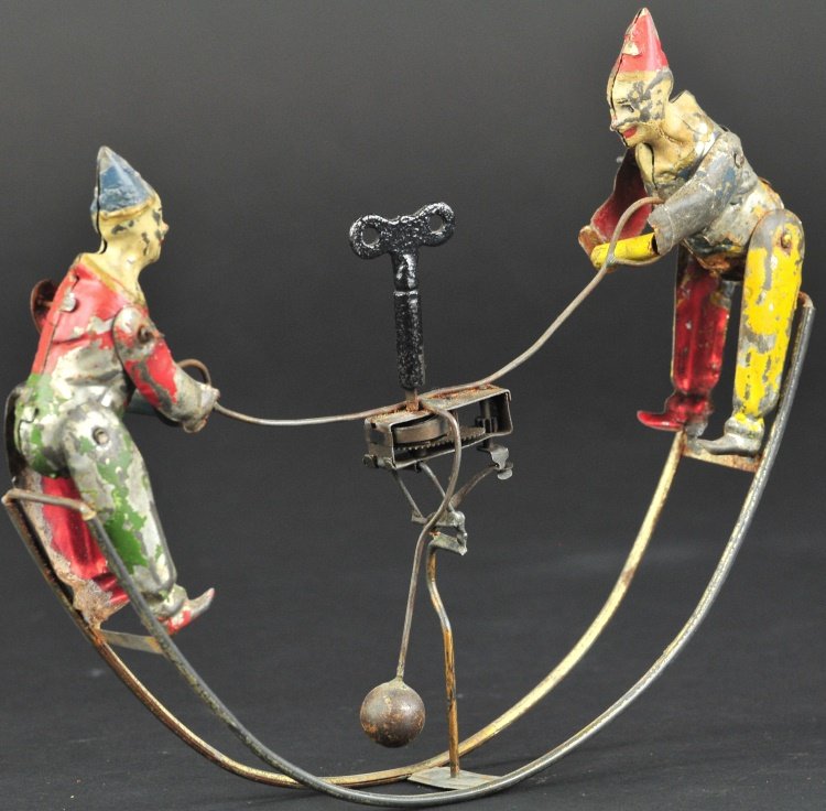 MECHANICAL ROCKING TOY WITH CLOWNS