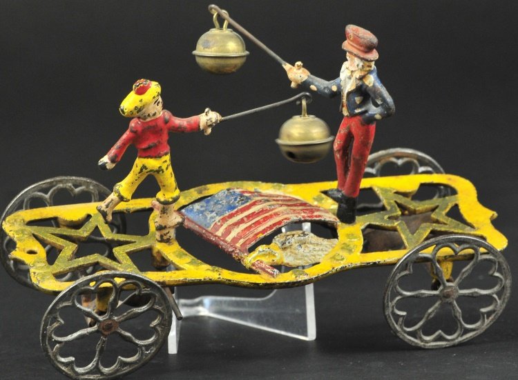 UNCLE SAM AND THE DON BELL TOY: No. 53, cast iron and hand painted, well cast example features two figures seemingly dueling over America's superiority over Spain, nice articulated action. 7 1/4" l.