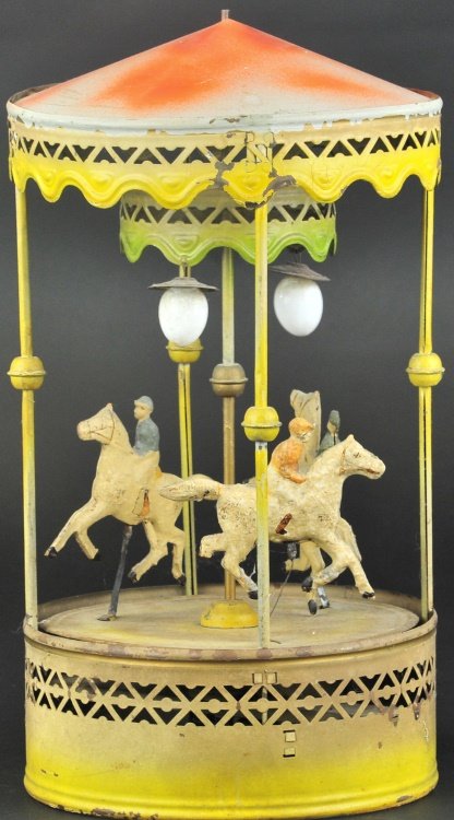 LARGE CAROUSEL: Germany, Gunthermann, c. 1910, hand painted tin, features three horses with riders at center, canopy roof, clockwork driven. 17" h.