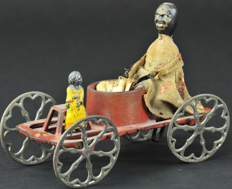 IVES WASHER WOMAN AND CHILD BELL TOY: circa 1885, very rare example, cast iron platform features cast tub at center and seat at one end, articulated axle allows seated woman to seemingly wash clothes in tub while child sits quietly at fro