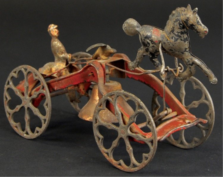 MAN RIDING CART WITH HORSE BELL TOY: Attributed to Gong Bell Co., cast iron open base painted in red with tin man in open seat and solo horse painted in black, articulated action allows back and forth motion while bell rings. 7 1/2" l.