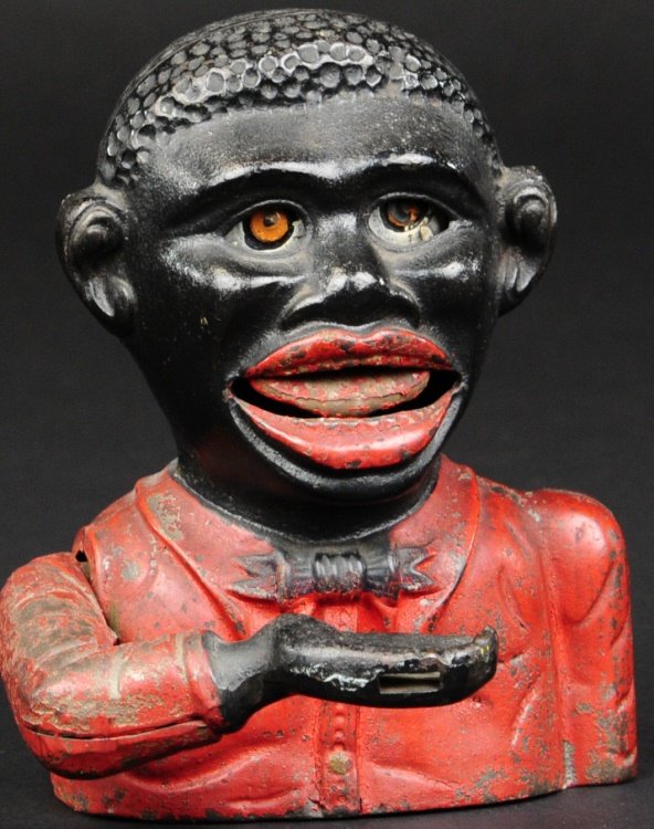 LITTLE JOE MECHANICAL BANK: Mfg. John Harper & Co., Willenhall, England, circa 1915, cast iron and hand painted in typical red shirt, rear lever allows hand with placed coin to be tossed into mouth slot as eyes roll back, emboss