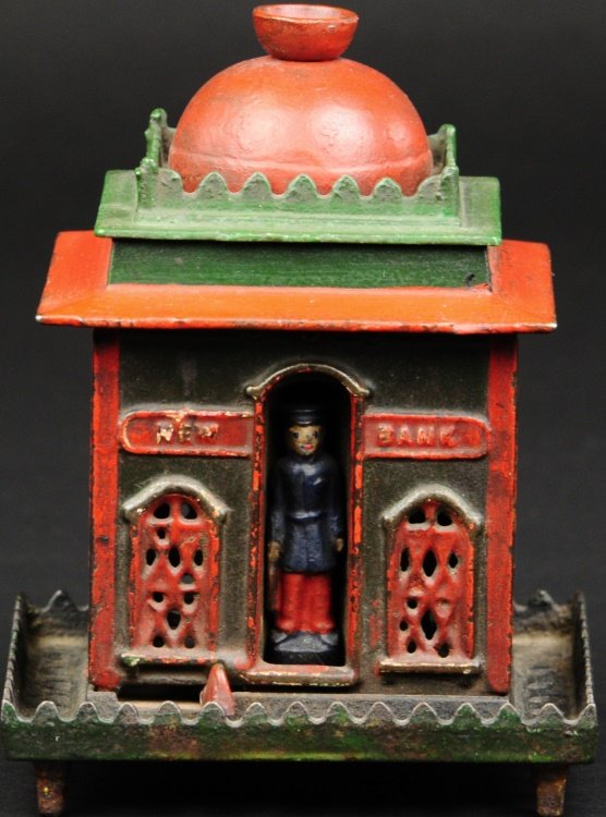 NEW MECHANICAL BANK - LEFT LEVER: J. & E. Stevens Co., circa 1872, cast iron and painted in red and green, sliding front lever to the left exposes coin slot at center, release lever and soldier returns to guard his post.