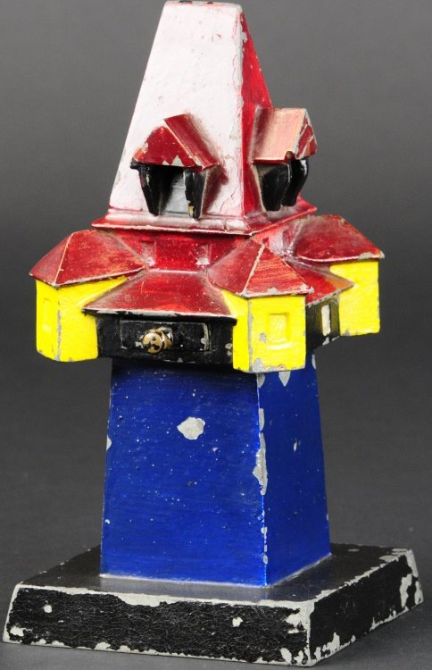 CLOCK TOWER MECHANICAL BANK: Germany, circa pre-1930, made of lead and hand painted, typical German or Austrian structure, coin deposits into drawer, gabled roofs are well designed.