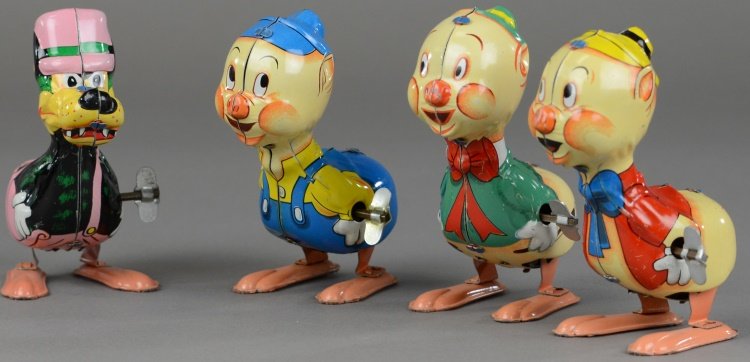 LINEMAR DISNEY'S THREE LITTLE PIGS & BIG BAD WOLF: Litho tin wind-up toys, all able to hop when wound, includes: Pig with flute, pig with violin and pig with trowel, together with the Big Bad Wolf. Pigs marked "Walt Disney Productions." 4" h.