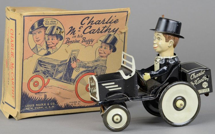 CHARLIE McCARTHY BENZINE MOBILE: Louis Marx, boxed example, lithographed tin, features Charlie seated in open black and white auto, clockwork mechanism, car marked "Charlie McCarthy," "Marx" symbol and "Pat. Pending Made in USA." 7 1