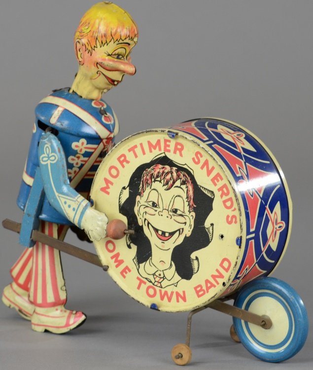 MORTIMER SNERD DRUMMER: Lithographed tin, depicts Mortimer in parade dress wheeling large colorful bass drum, clockwork. 8 1/2" h.