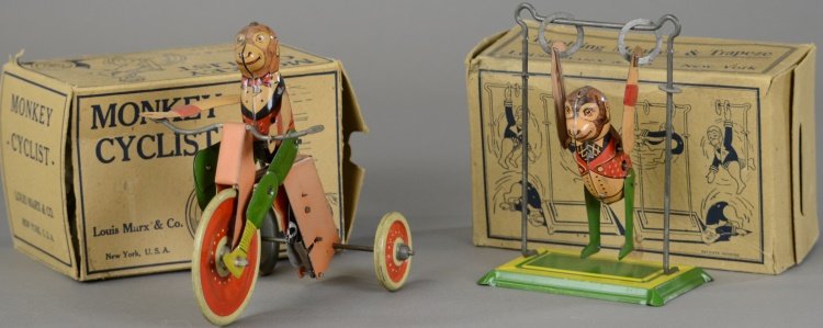 BOXED MONKEY CYCLIST AND ACROBAT TOY: Louis Marx, lithographed tin, depicts monkey in outfit riding three wheeler, key wind operated with articulated legs, together with tumbling monkey and trapeze, both have box. 6" h.