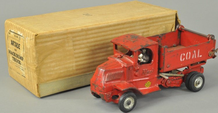 BOXED ARCADE MACK COAL TRUCK: Cast iron, painted in red overall, open dump body has opening tailgate, stenciled "COAL" on sides, nickeled driver, black rubber tires, Arcade decal. 10" l.