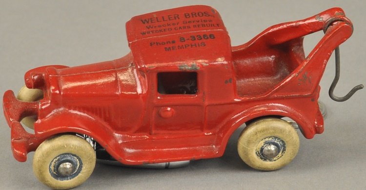 AUSTIN WRECKER WITH ROOF AD: Arcade, cast iron, painted in red overall, roof lettered, "Weller Bros. Wrecker Service…Memphis." 4 1/2" l.