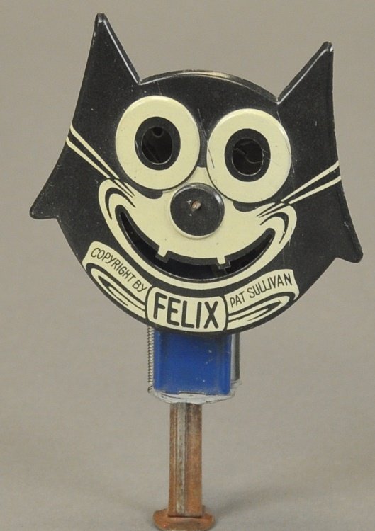 FELIX THE CAT SPARKLER: copr. Pat Sullivan, made by Chein, lithographed tin, done in black and white highlights, referred to as the long ears variation, strong action. 5" h.