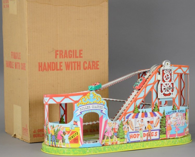 CHEIN ROLLER COASTER TOY WITH BOX: Lithographed tin, wind-up action, conveyor belt propels lithographed autos up the track, visually appealing toy with nice graphics. 18 1/2" l.