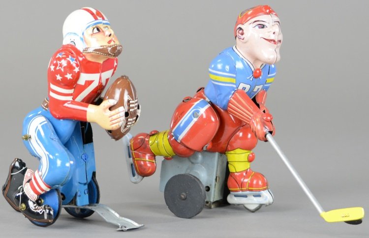 TOUCHDOWN PETE AND HOCKEY PLAYER WIND-UP TOYS: T.P.S., Japan, lithographed tin football player with ball in hand and hockey player with stick in hand, wind-up actions. 5 3/4" h.