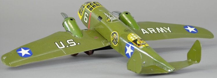 MARX BOMBER: Lithographed tin, done in army green colors, two props, clockwork action, graphics of bomber at fuselage. 18" wingspan.