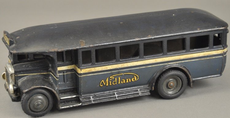 "MIDLAND" BUS: England, Wallwork & Co., Ltd., scarce cast iron example, painted in blue body, dark blue roof, disc wheels with rubber tires, decals on sides. 12" l.