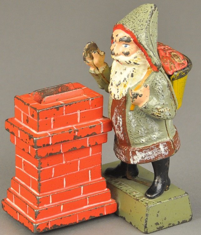 SANTA AT CHIMNEY MECHANICAL BANK: Shepard Hardware Co., designed by Charles Shepard & Peter Adams, Patented 1889. Place a coin in Santa’s hand, press the lever, and he tosses the coin into the chimney.