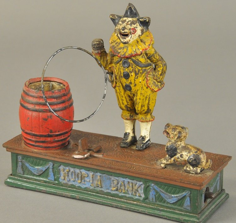 HOOPLA MECHANICAL BANK: John Harper & Co. Ltd., Patented 1897, place a coin in the dogs mouth and press the lever; he jumps through the hoop and deposits the coin in the barrel.