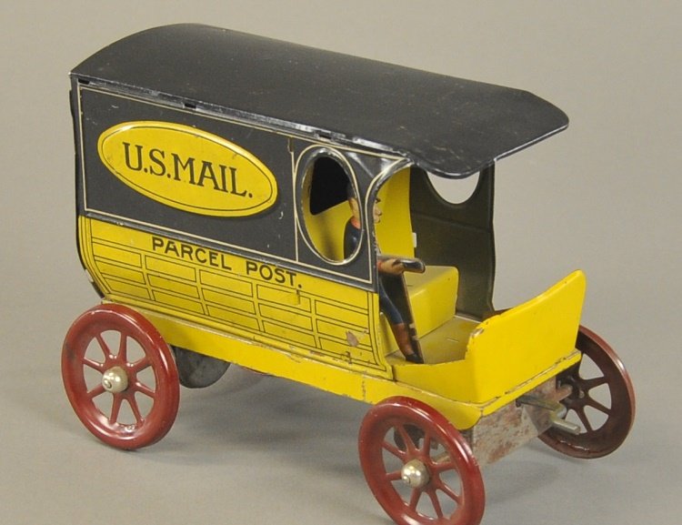 A.C. GILBERT "U.S. MAIL" VAN: c. 1930's, lithographed tin, yellow van truck with black roof, simulated panel van body, seated driver, spring barrel mechanism, red spoke wheels. 8" l.