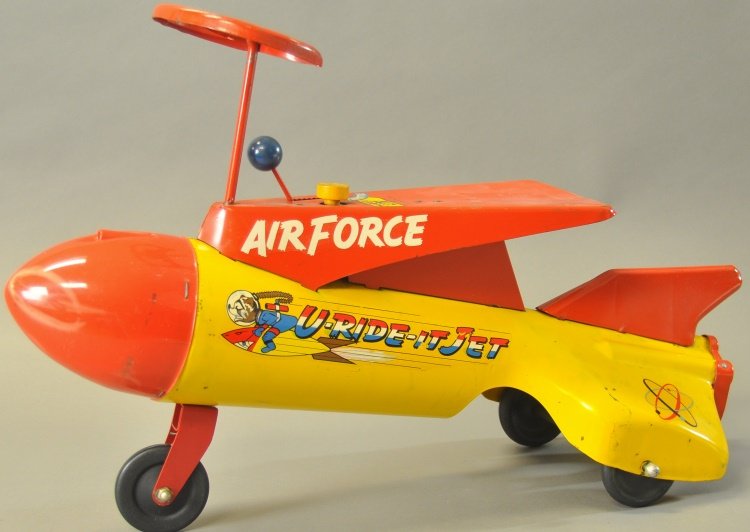 ROBERT'S SIT AND RIDE ROCKET SHIP: 1950's, pressed steel, painted in red nose, yellow fuselage and fins, features "U-Ride-It Jet Air Force" decals on sides. 26" l.