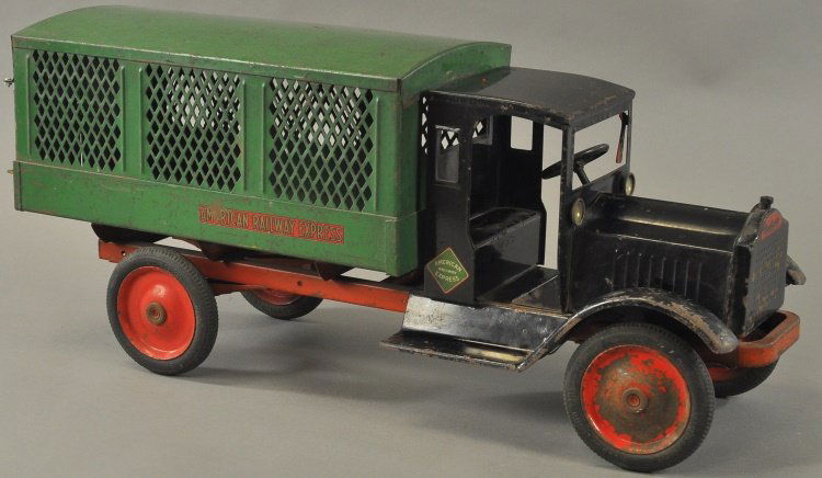 KEYSTONE PACKARD AMERICAN RAILWAY EXPRESS TRUCK: c. 1926, pressed steel, enclosed doorless cab, red chassis, green three screen panel van body, opening rear doors, red disc wheels and rubber tires. 26" l.