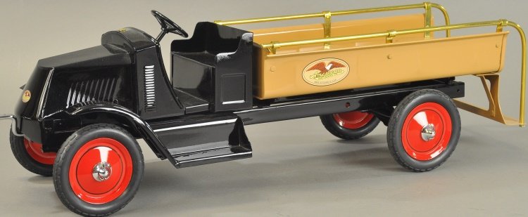 AMERICAN NATIONAL POLICE TRUCK: Scarce example, circa 1925, pressed steel, painted in tan body with bench seating and low back cab, fully railed sides, rubber tires and side decals. 28" l.