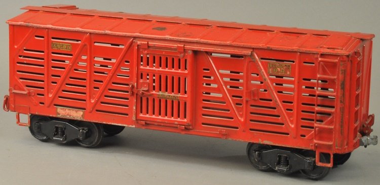 BUDDY 'L' STOCK CAR #1004: c. 1926-1931, Outdoor Railroad Series, pressed steel, done in red overall, black trucks, sides stamped "68502," slat board design with opening body door. 22 1/4" l.