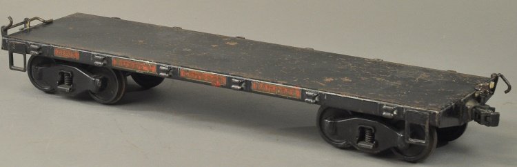 BUDDY 'L' OUTDOOR RAILROAD FLAT CAR: Pressed steel, painted in black overall, decal reads, "68502," stake pockets on each side. 20" l.