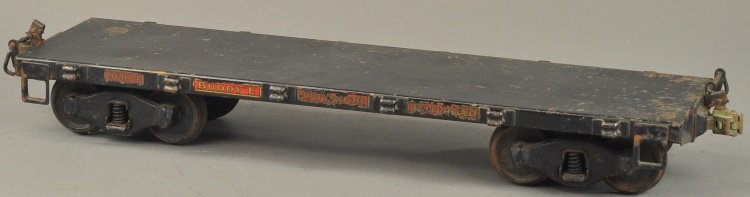 BUDDY 'L' OUTDOOR RAILROAD FLAT CAR: Pressed steel, painted in black overall, decal reads, "96834," stake pockets on each side. 20" l.