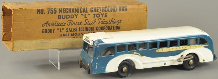BUDDY 'L' GREYHOUND BUS: Pressed steel, classic blue and white paint, decal reads "Greyhound" logo and name, battery operated tail light, wind-up rolling action opens doors, rings bell. 16 1/2" l.