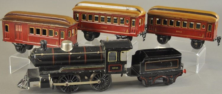 MARKLIN PENNSYLVANIA TRAIN SET: Germany, includes 0-4-0 clockwork driven steam type locomotive, gauge '1', with tin four wheel tender, together with two passenger coaches and Pennsylvania combine, all in brown litho bodies. Cars 8" 