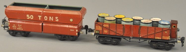 MARKLIN 'O' GAUGE FREIGHT CARS: Germany, includes 50 Ton Hopper in brown, and gondola with brake house, contains eight oil barrels, both eight wheel examples. 9 1/2" l.