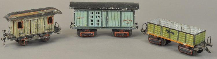 MARKLIN TRAIN CAR GROUPING: Germany, early gauge '1' hand painted tin freight car lot includes: gondola, box car and goods car with interior guards house. Approx. 9 1/2" l.