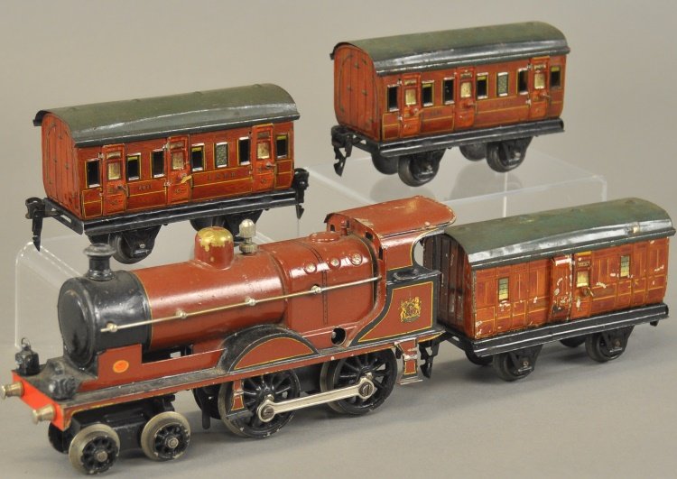 MARKLIN 4-4-0 ENGINE AND 'O' GAUGE CARS: Germany, English Midland style, clockwork driven, together with two "LNER" coaches and "LNER Guards Van," all in matching brown wood simulated bodies. Cars 5 1/4" l.