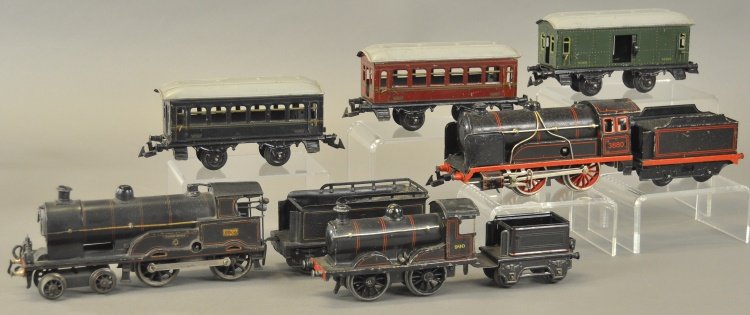 'O' GAUGE TRAIN GROUPING: Germany, includes: Bing 'O' gauge 0-4-0 #3880 clockwork driven steam locomotive with tin tender, Marklin steam type locomotive and tender, Bing Bassett-Lowke 4-4-0 "Queen Mary" loco and tender, togeth