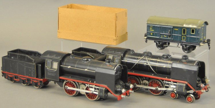 MARKLIN TRAIN GROUPING: Germany, lot includes: 'O' gauge 0-4-0 electric engine and tender, 4-4-0 steam type electric engine and tender, and one boxed baggage car in blue. Cars 6 1/4" l.